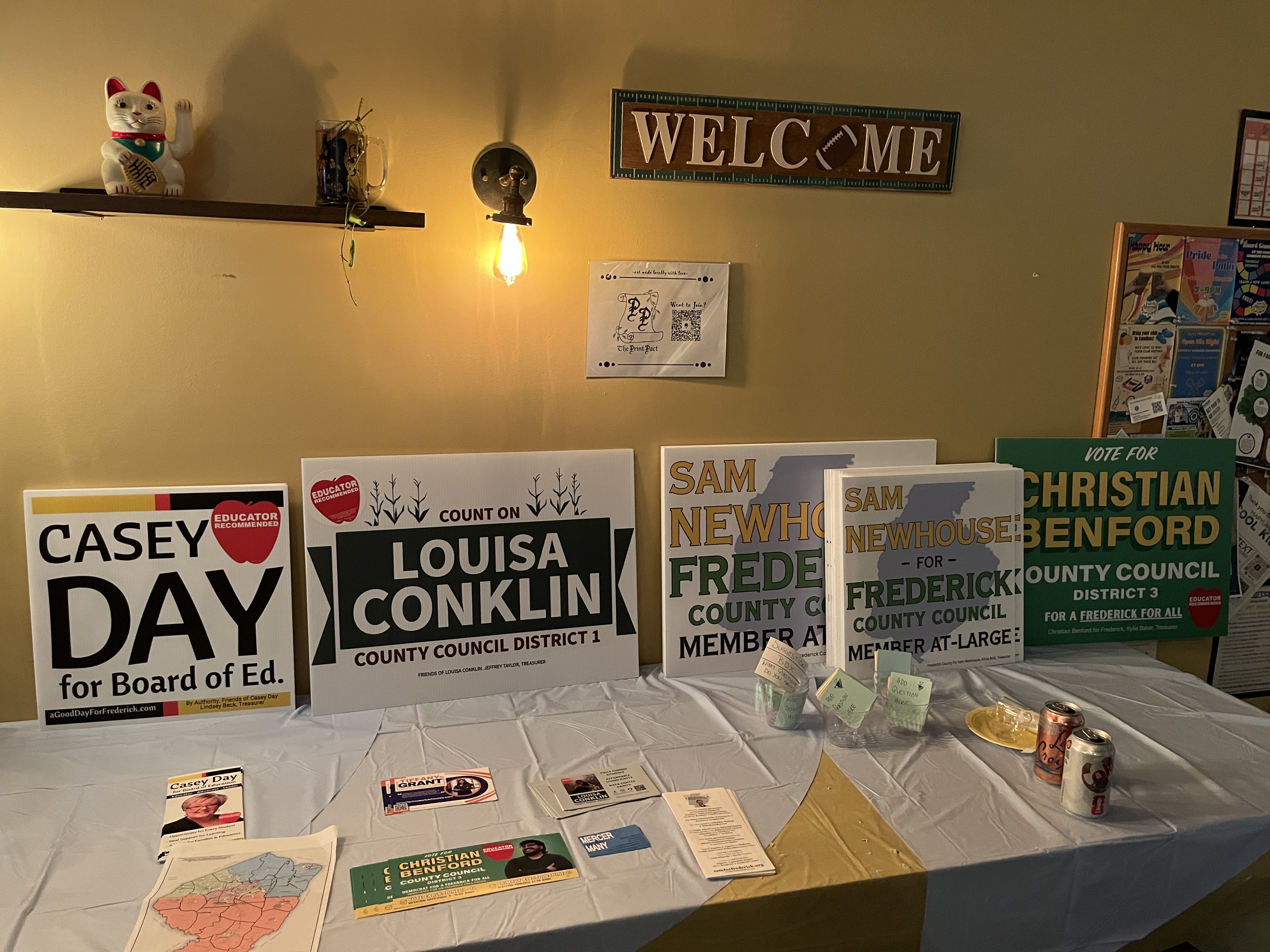 Campaign signs from Sam and fellow Frederick County candidates at the launch event